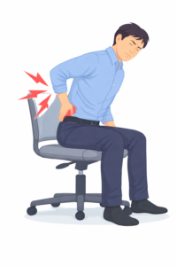 「椅子に座っている男性が、腰を押さえて痛みを感じている様子のイラスト」